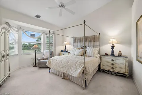 a bedroom with bed and window