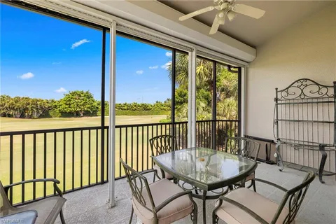 a view of a balcony with furniture