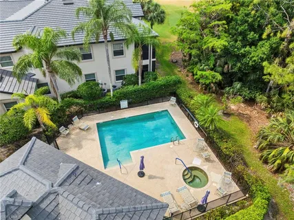 a view of a backyard with plants and a patio