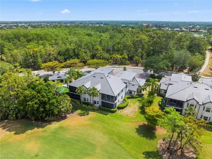 an aerial view of a house with big yard
