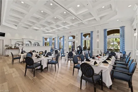 a room with lots of chairs and wooden floor