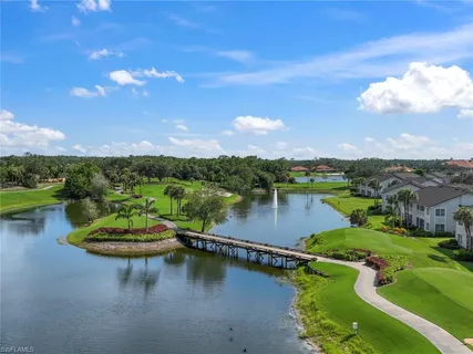 a view of an house with swimming pool and porch