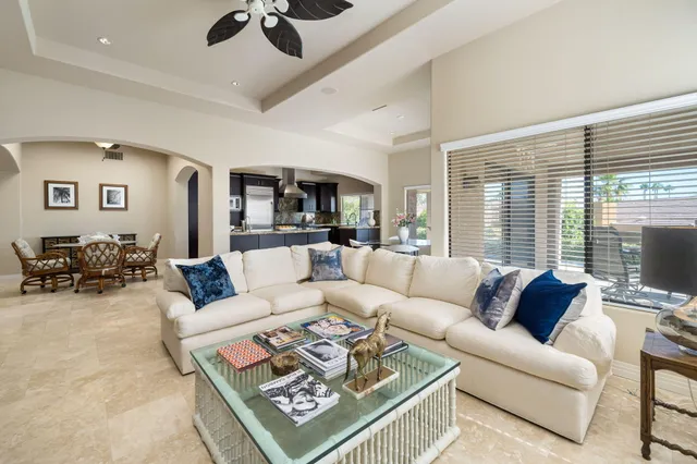 a living room with furniture or couch and a large window