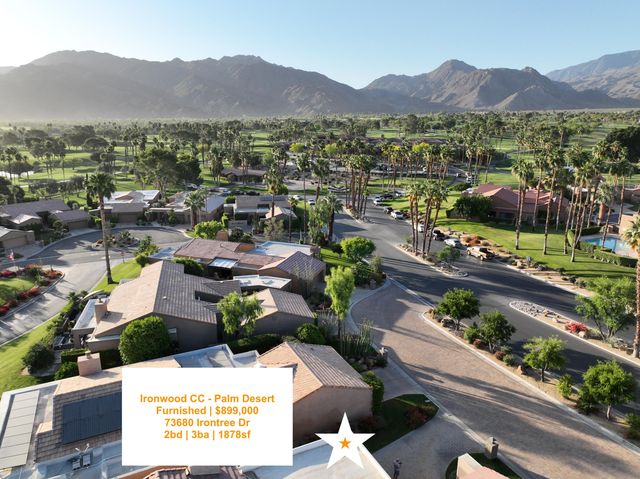 a view of a livingroom with furniture and a potted plant