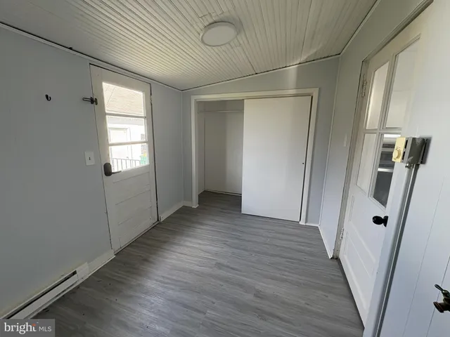 a view of entryway with wooden floor