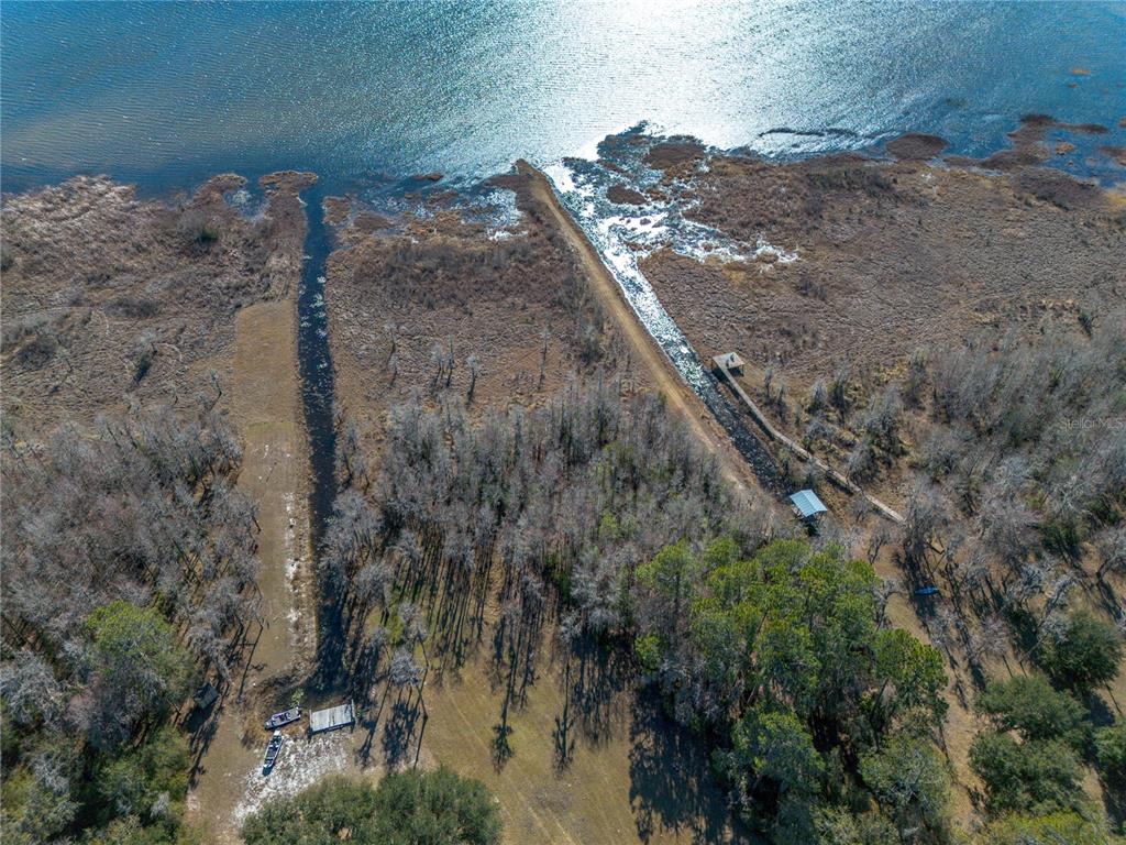 155th Way Starke, FL 32091 - Photo 16 of 29 a view of a dry yard with trees