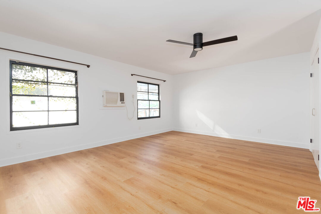 822 North Detroit Street, Unit 826 5 Los Angeles, CA 90046 - Photo 11 of 14 wooden floor in an empty room with a window