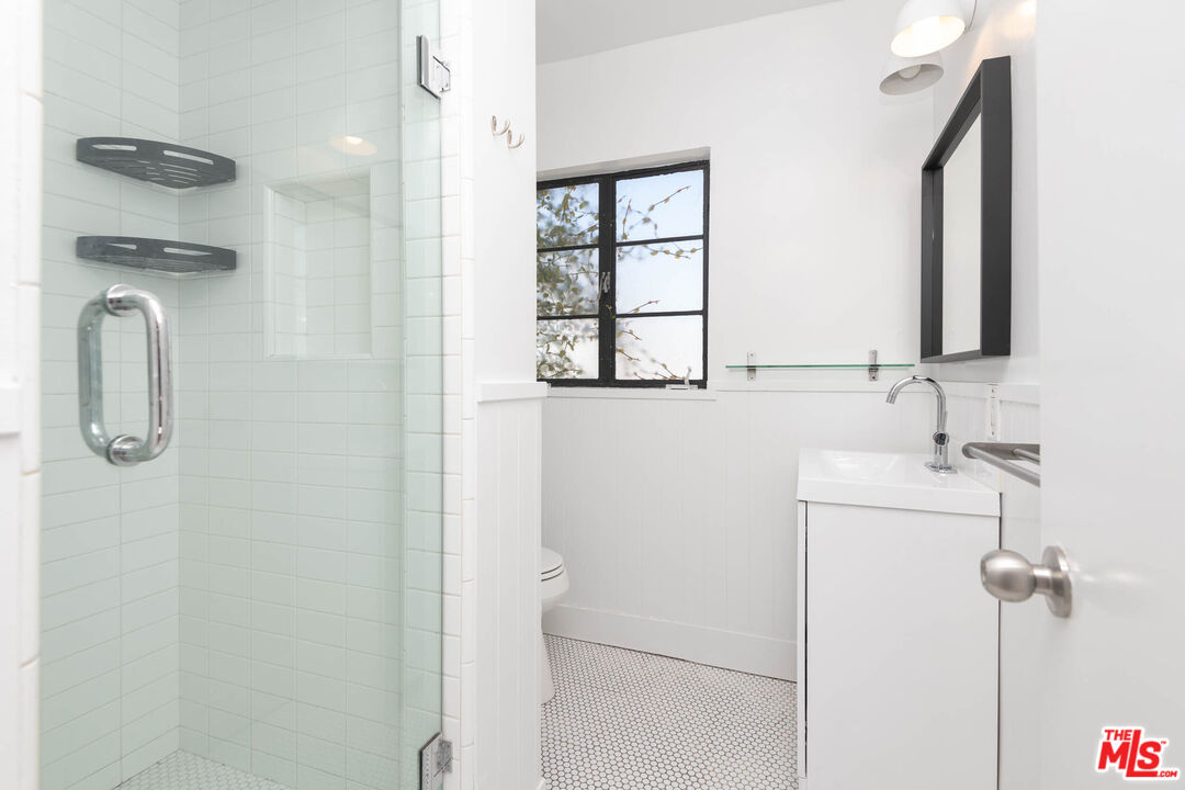 822 North Detroit Street, Unit 826 5 Los Angeles, CA 90046 - Photo 13 of 14 a bathroom with a shower