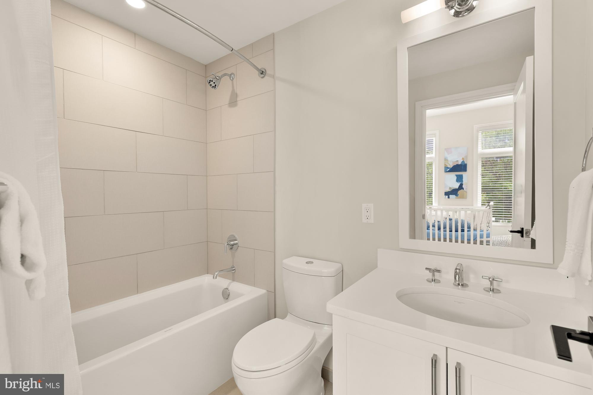 415 Guethler's Way Washington, DC 20003 - Photo 21 of 32 a bathroom with a bathtub shower sink vanity mirror and toilet