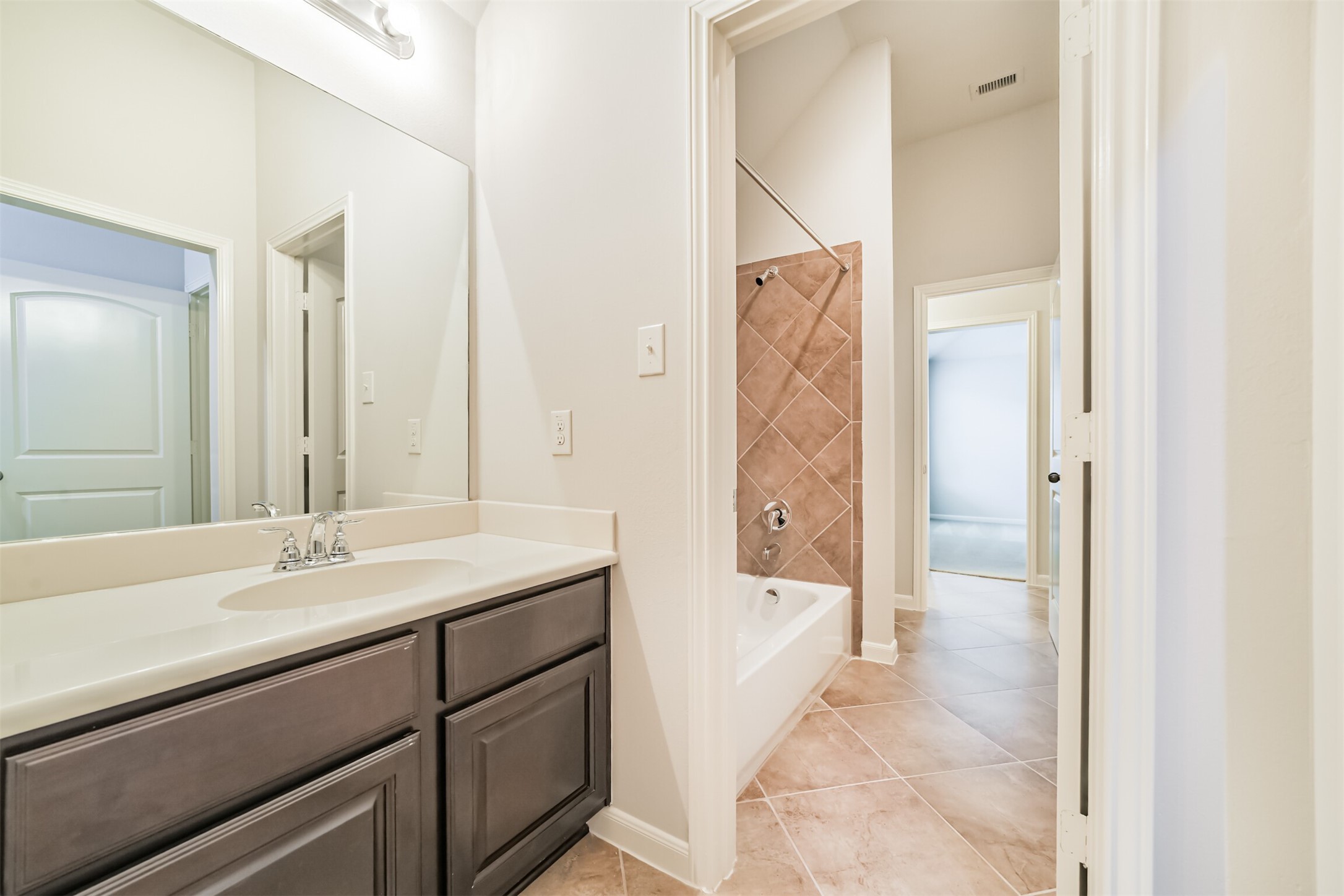 13607 Breakwater Path Loop Houston, TX 77044 - Photo 30 of 48 a bathroom with a sink and a mirror