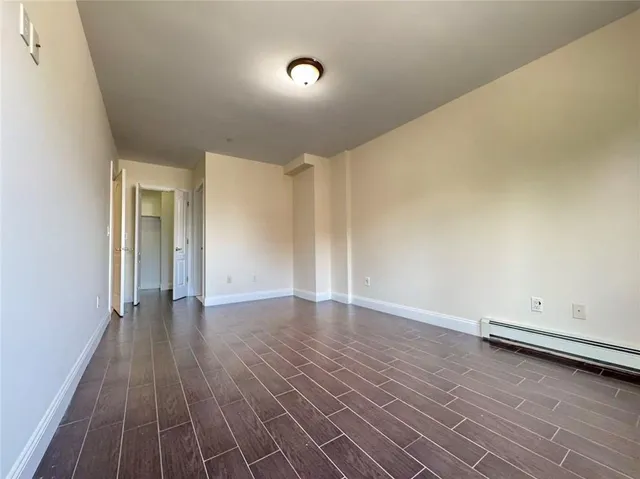 a view of room with hardwood floor