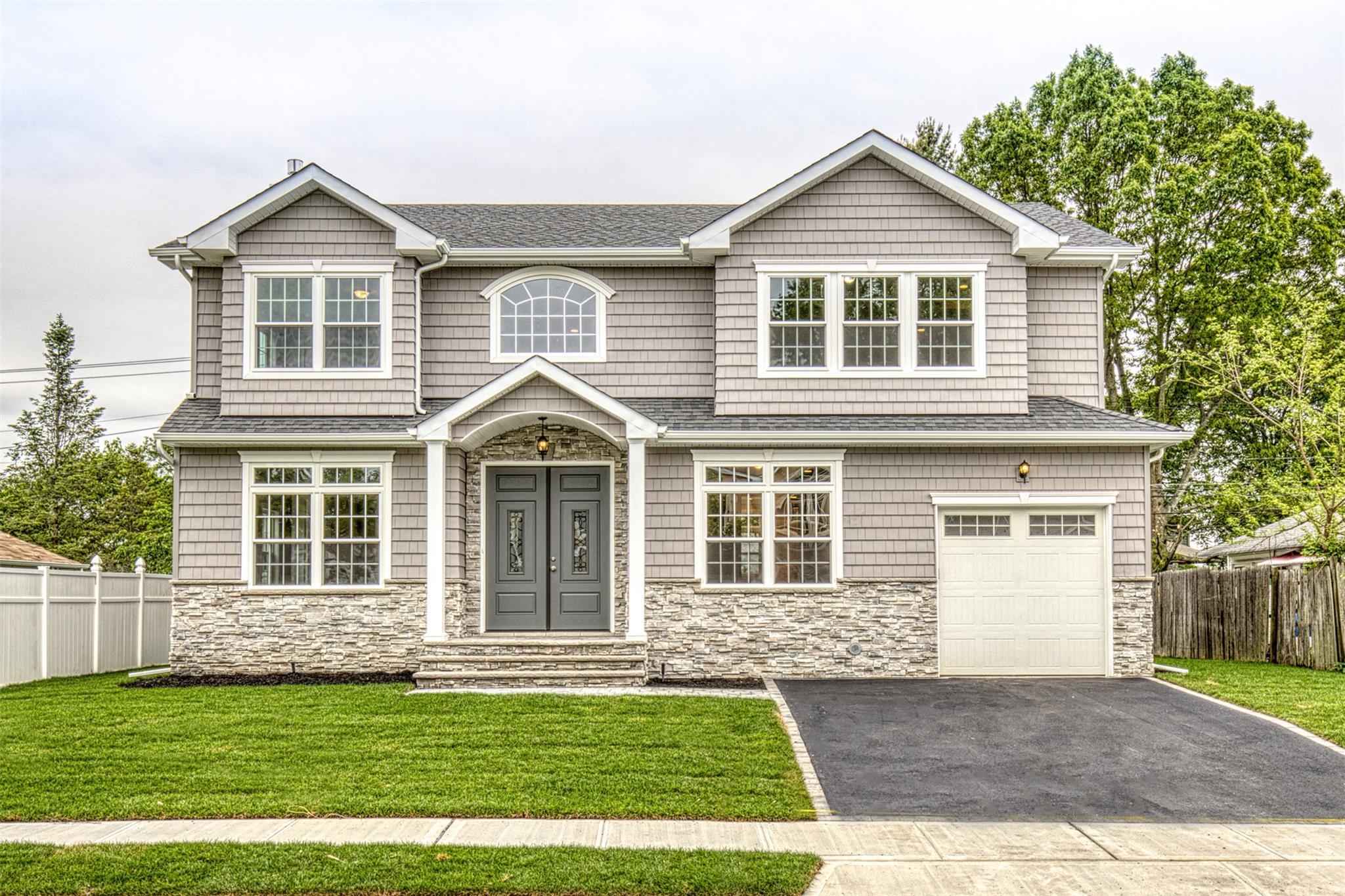 a front large house with a yard