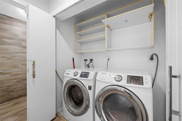 a utility room with dryer and washer