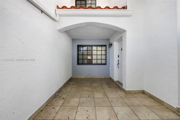 a view of an empty room and window