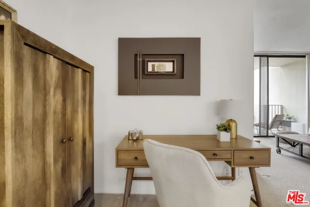 a view of a workspace with furniture