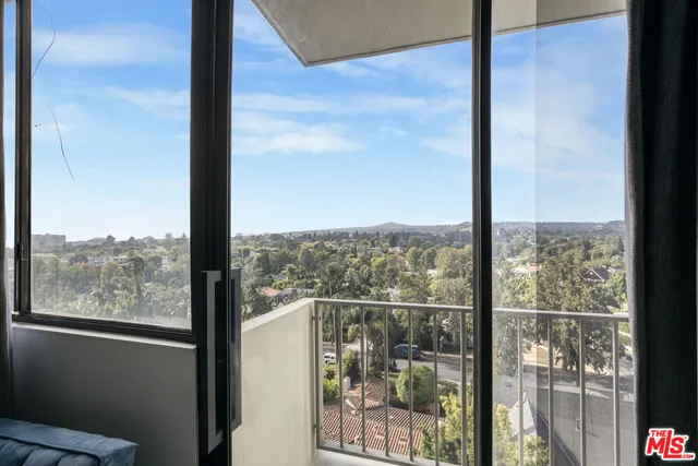 a view of a glass door and porch
