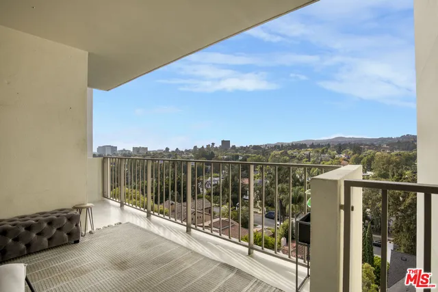 a view of a balcony with an ocean view