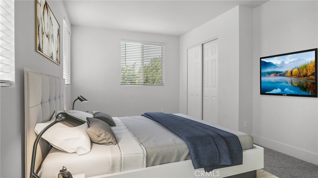 330 East 101st Street Los Angeles, CA 90003 - Photo 11 of 15 a bedroom with a bed and a painting on the wall