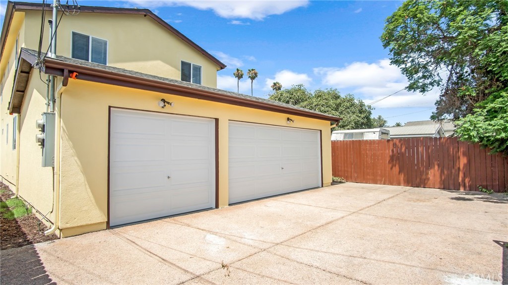 330 East 101st Street Los Angeles, CA 90003 - Photo 15 of 15 a front view of a house with a garage
