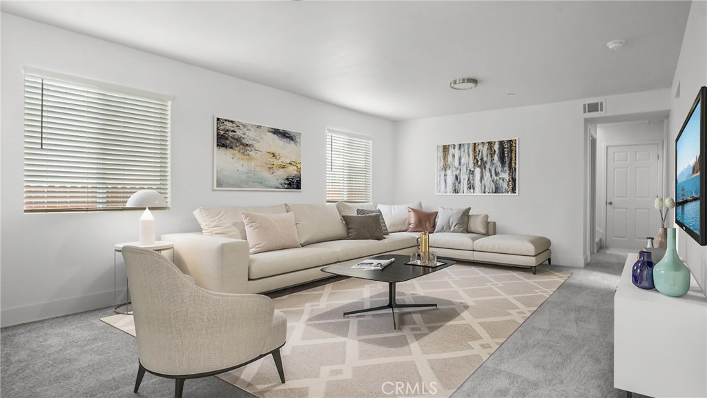 330 East 101st Street Los Angeles, CA 90003 - Photo 2 of 15 a living room with furniture and a potted plant
