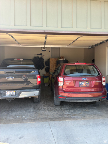 Garage with concrete flooring and light-colored walls