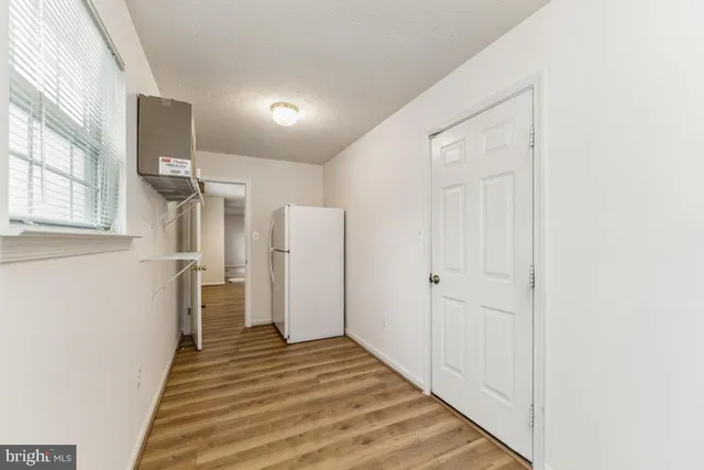 a view of a hallway with a white walls