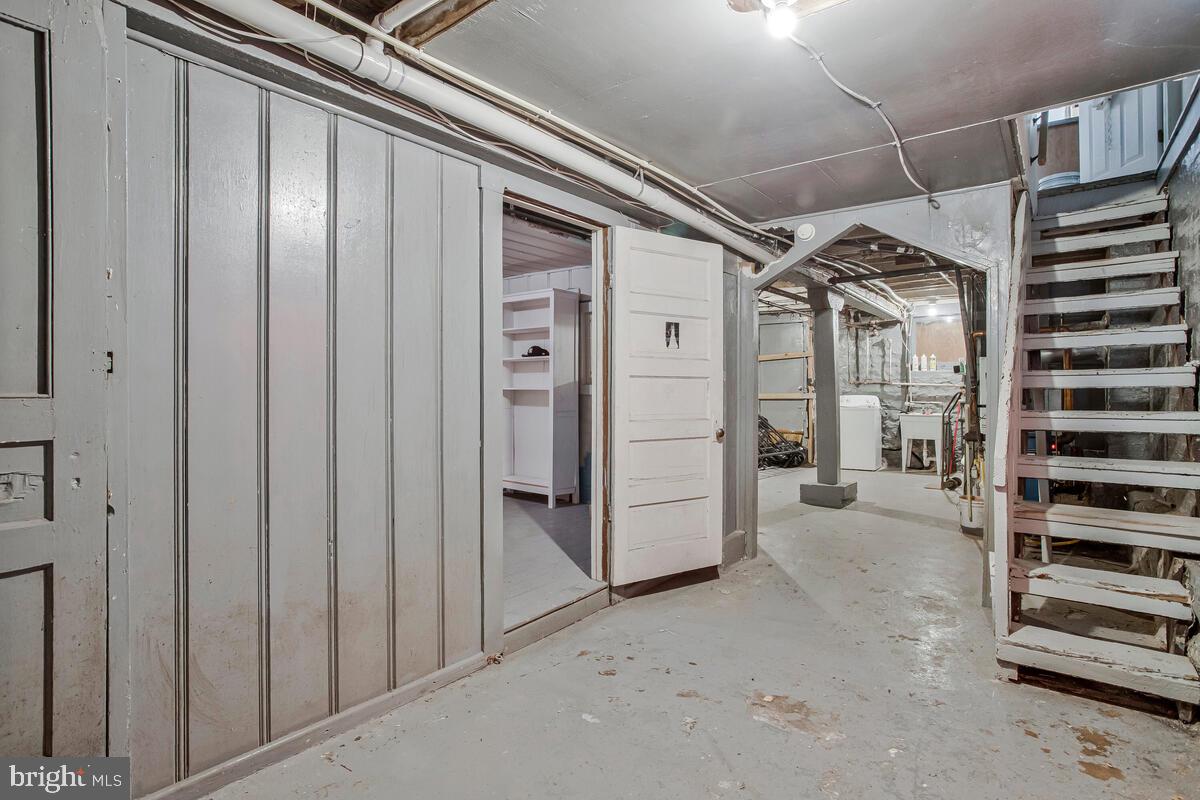 3516 Reisterstown Road Baltimore, MD 21215 - Photo 15 of 21 a view of a hallway with wooden cabinets