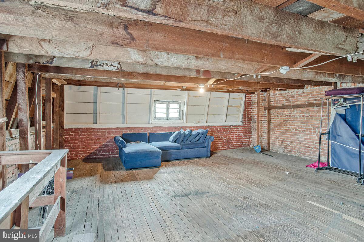 3516 Reisterstown Road Baltimore, MD 21215 - Photo 16 of 21 a view of livingroom with furniture and window