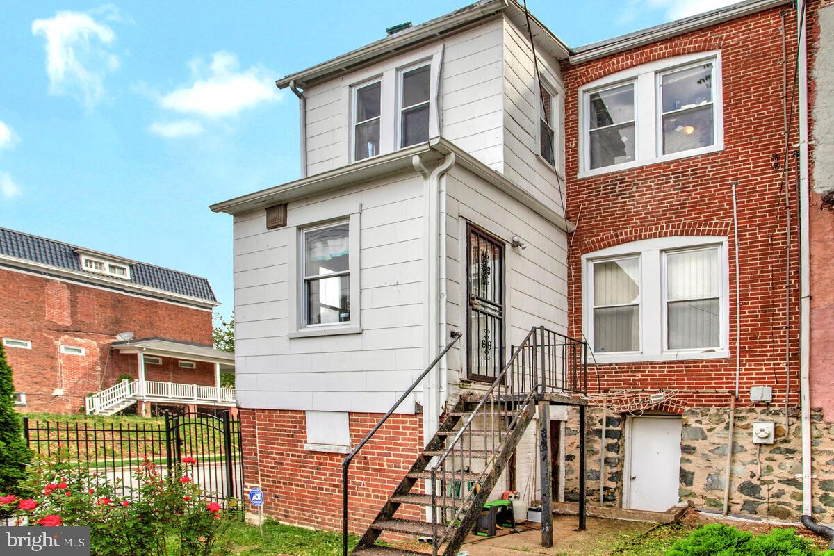 3516 Reisterstown Road Baltimore, MD 21215 - Photo 19 of 21 a view of a building next to a yard