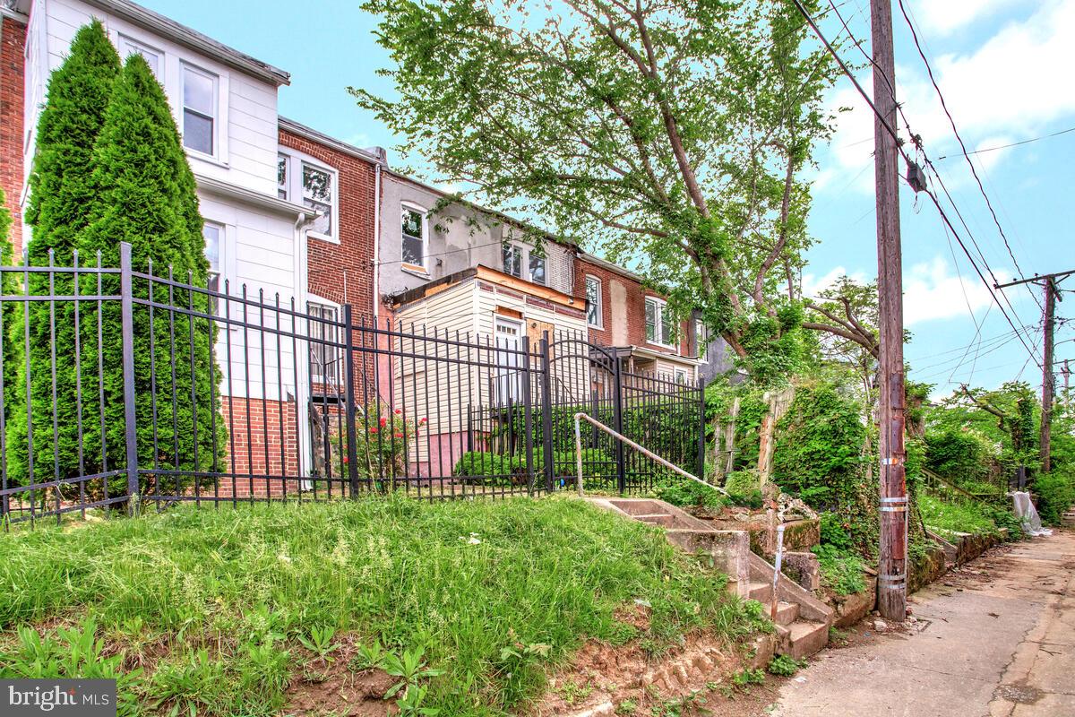 3516 Reisterstown Road Baltimore, MD 21215 - Photo 20 of 21 a view of a house with a yard and sitting area