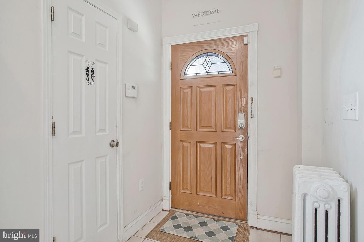 3516 Reisterstown Road Baltimore, MD 21215 - Photo 5 of 21 a view of front door with livingroom
