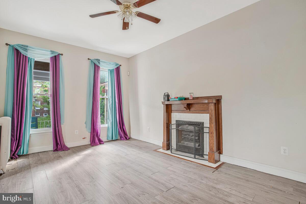 3516 Reisterstown Road Baltimore, MD 21215 - Photo 7 of 21 a view of a livingroom with a staircase