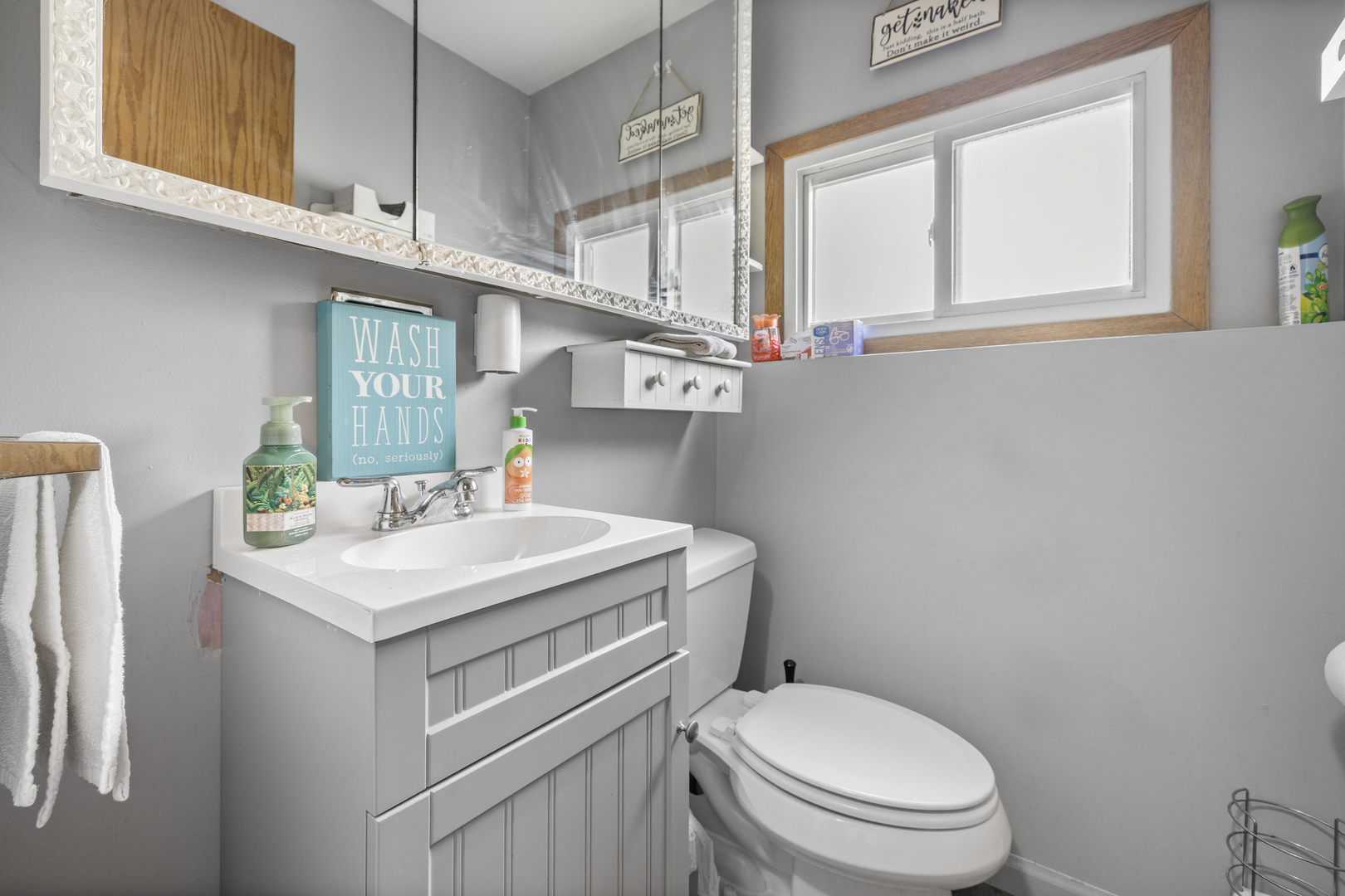 4 Saugatuck Road Montgomery, IL 60538 - Photo 10 of 24 a bathroom with a sink a toilet and a window