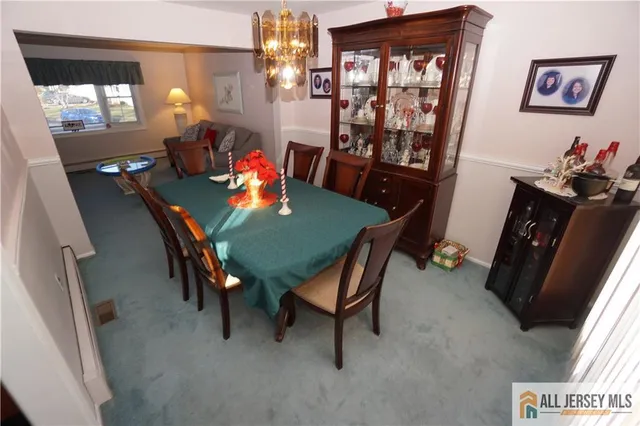 a view of a dining room with furniture and window