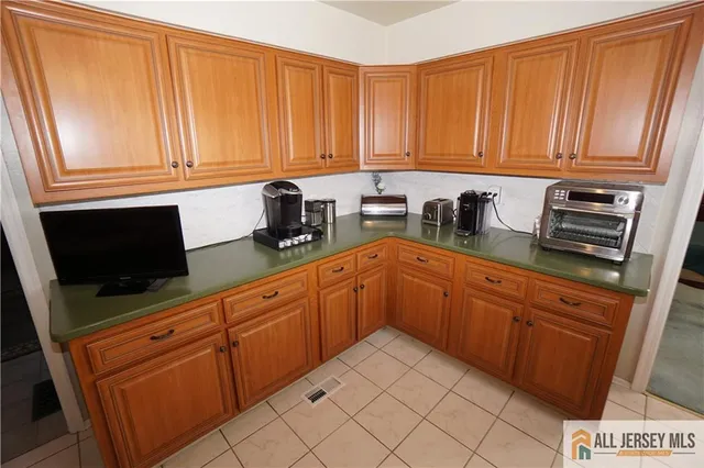 a kitchen with stainless steel appliances granite countertop a sink dishwasher stove and cabinets
