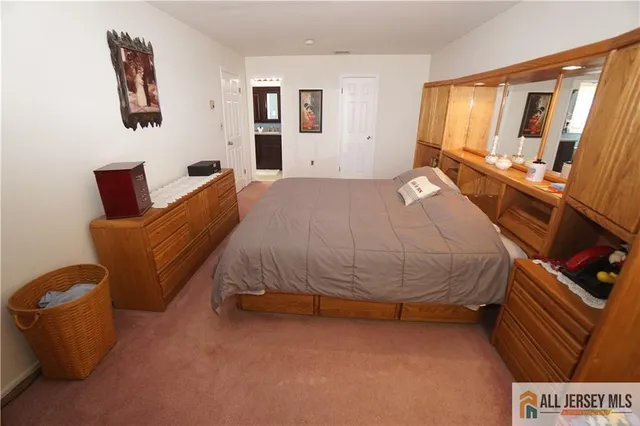 a bed sitting in a room next to a window