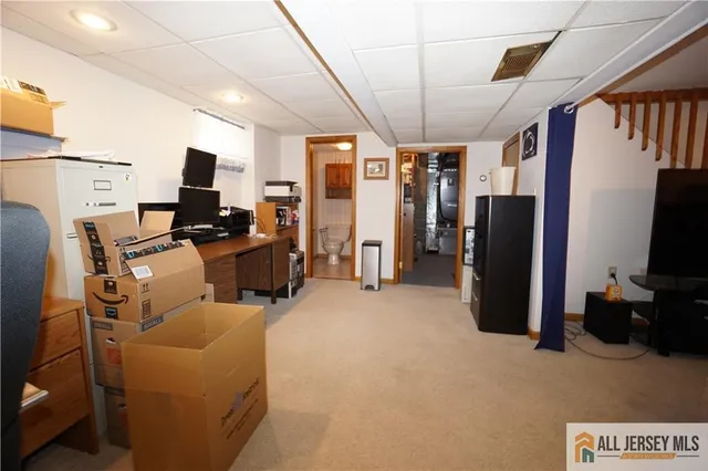 a view of a livingroom with furniture and a flat screen tv
