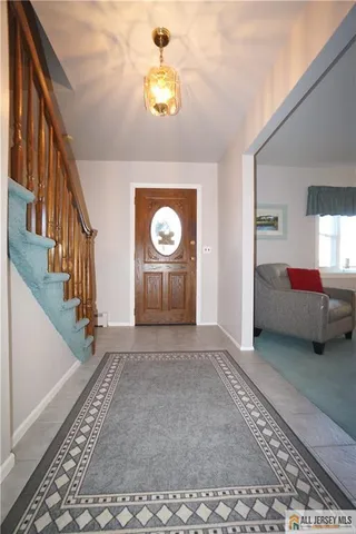 a view of an empty room and stairs