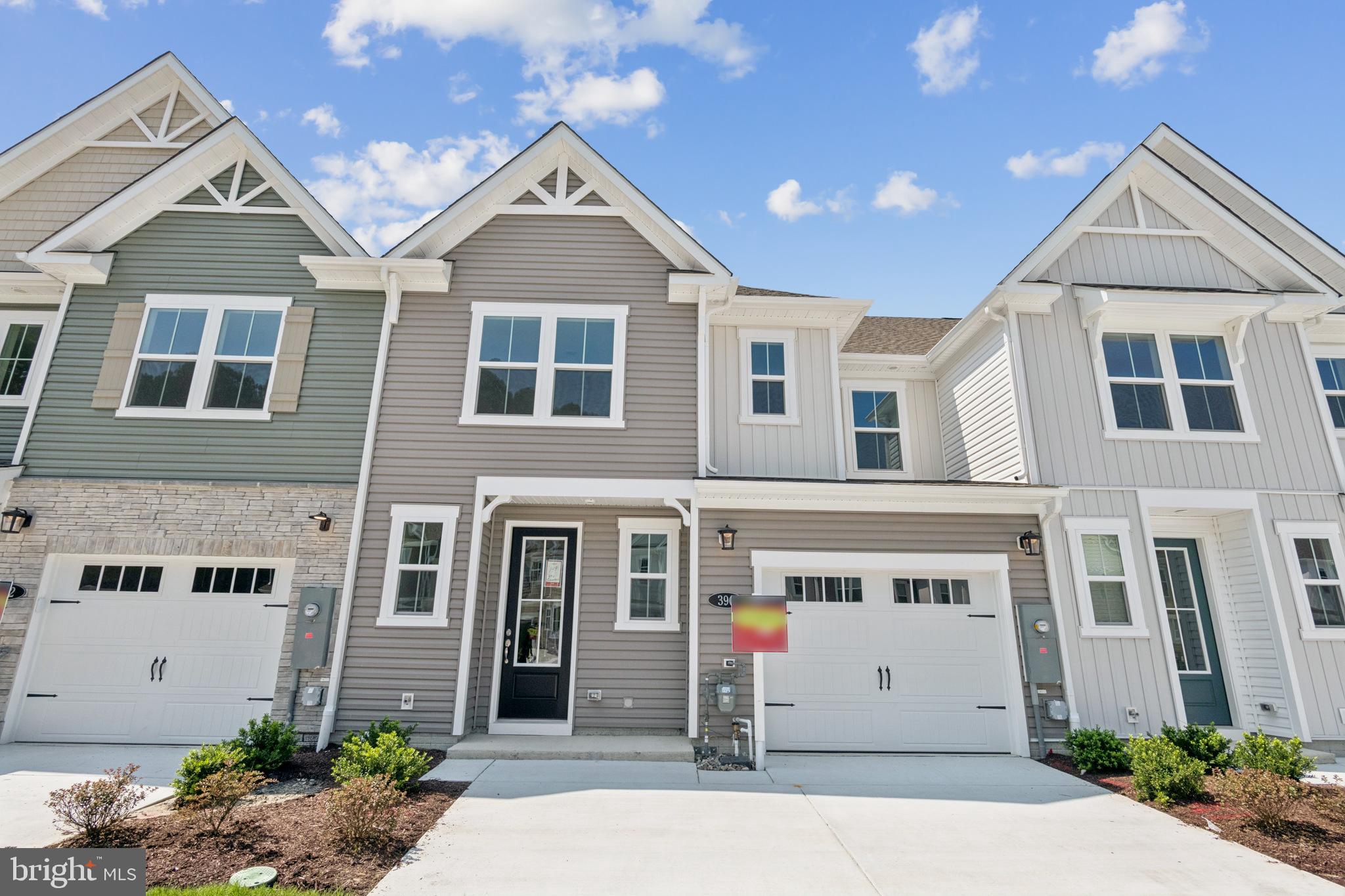 390 Scranton Lane Ocean View, DE 19970 - Photo 1 of 15 a front view of a house with a garage