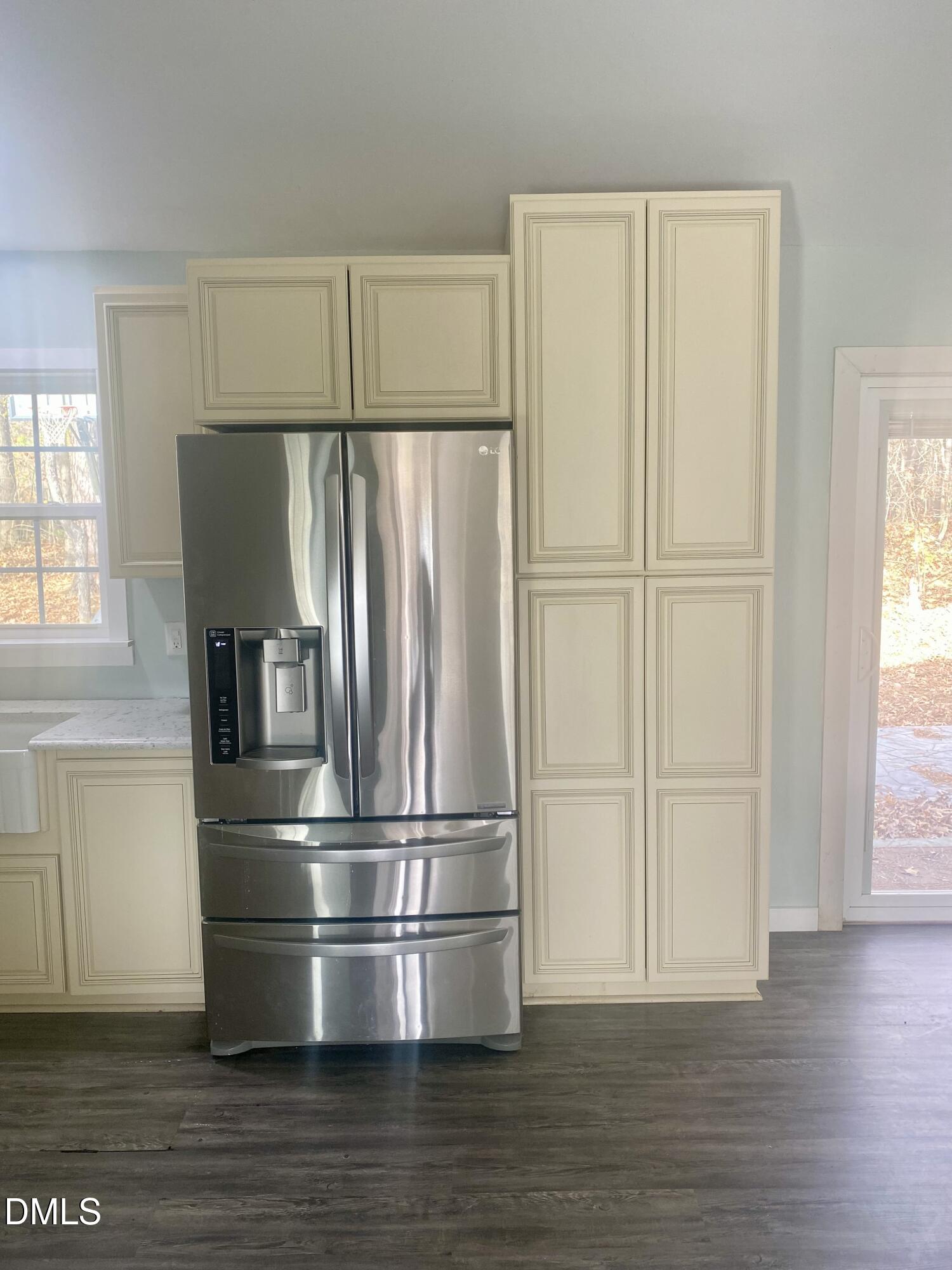 3182 Sims Bridge Road Kittrell, NC 27544 - Photo 11 of 44 a kitchen with stainless steel appliances wooden floor and window