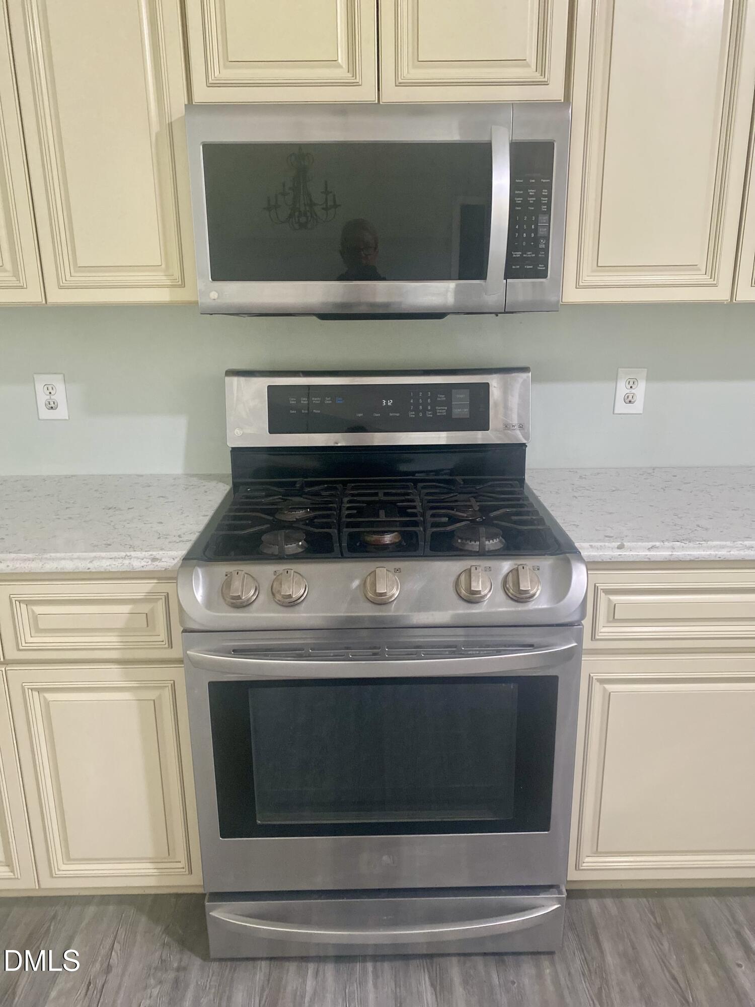 3182 Sims Bridge Road Kittrell, NC 27544 - Photo 12 of 44 a stove top oven sitting inside of a kitchen