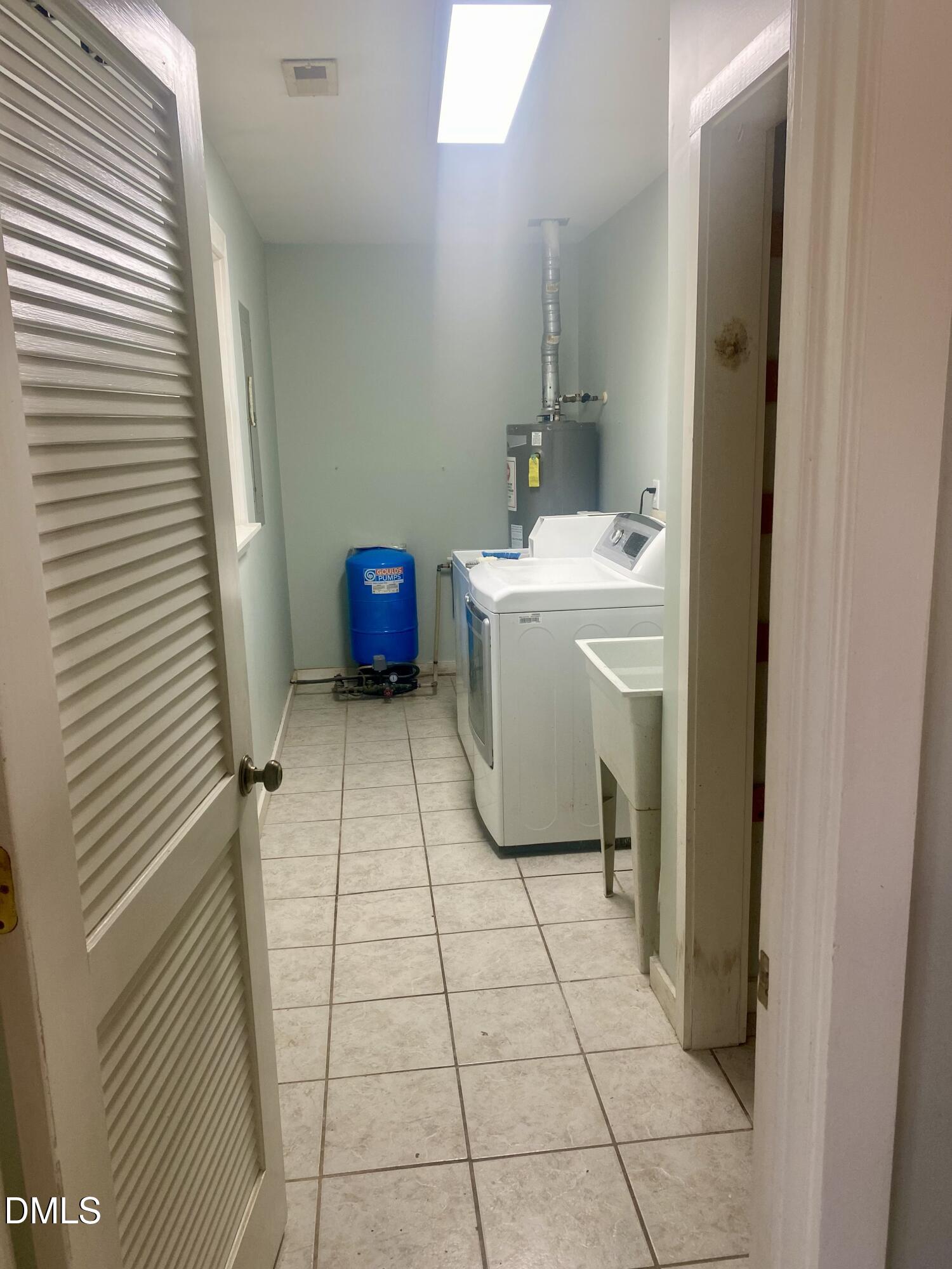 3182 Sims Bridge Road Kittrell, NC 27544 - Photo 15 of 44 a bathroom with a sink and a mirror