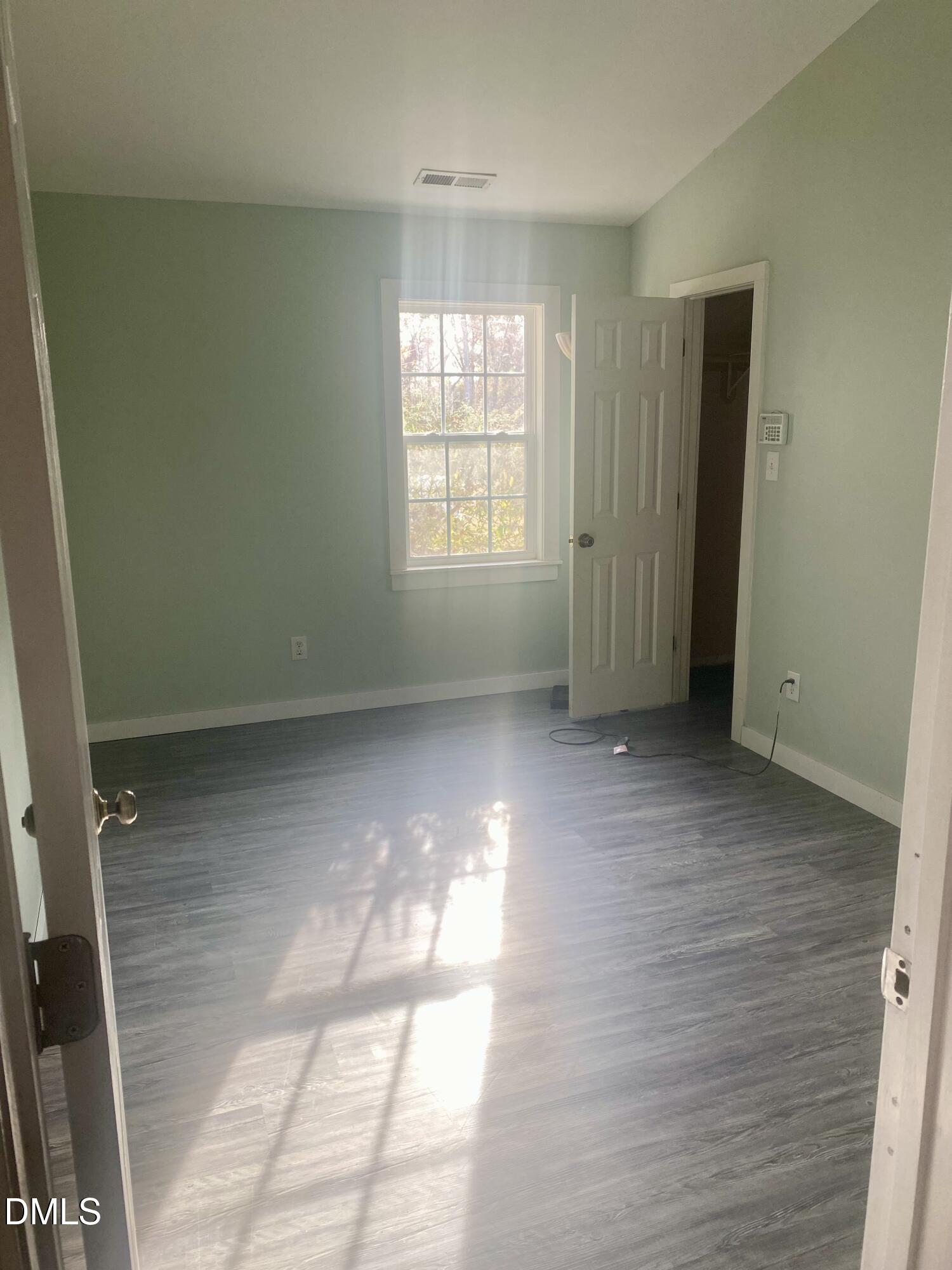 3182 Sims Bridge Road Kittrell, NC 27544 - Photo 20 of 44 a view of empty room with wooden floor and fan