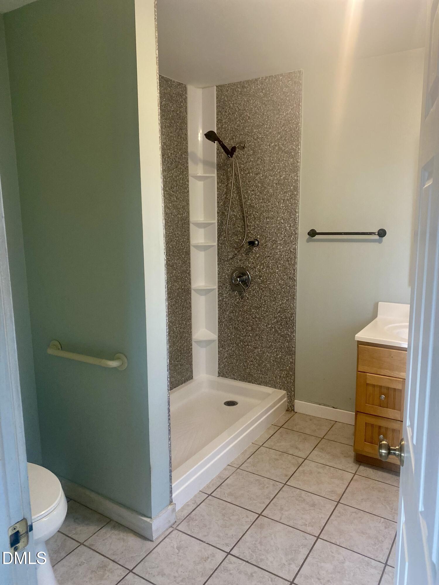 3182 Sims Bridge Road Kittrell, NC 27544 - Photo 28 of 44 a bathroom with a shower and a toilet