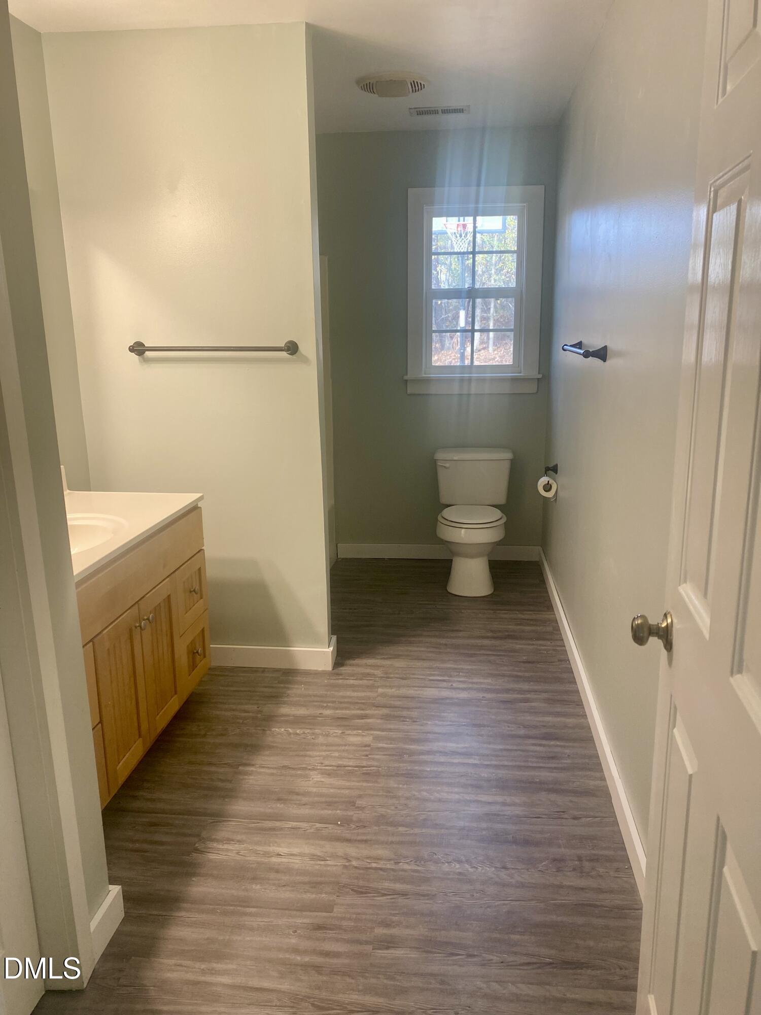 3182 Sims Bridge Road Kittrell, NC 27544 - Photo 38 of 44 a bathroom with a sink and a toilet