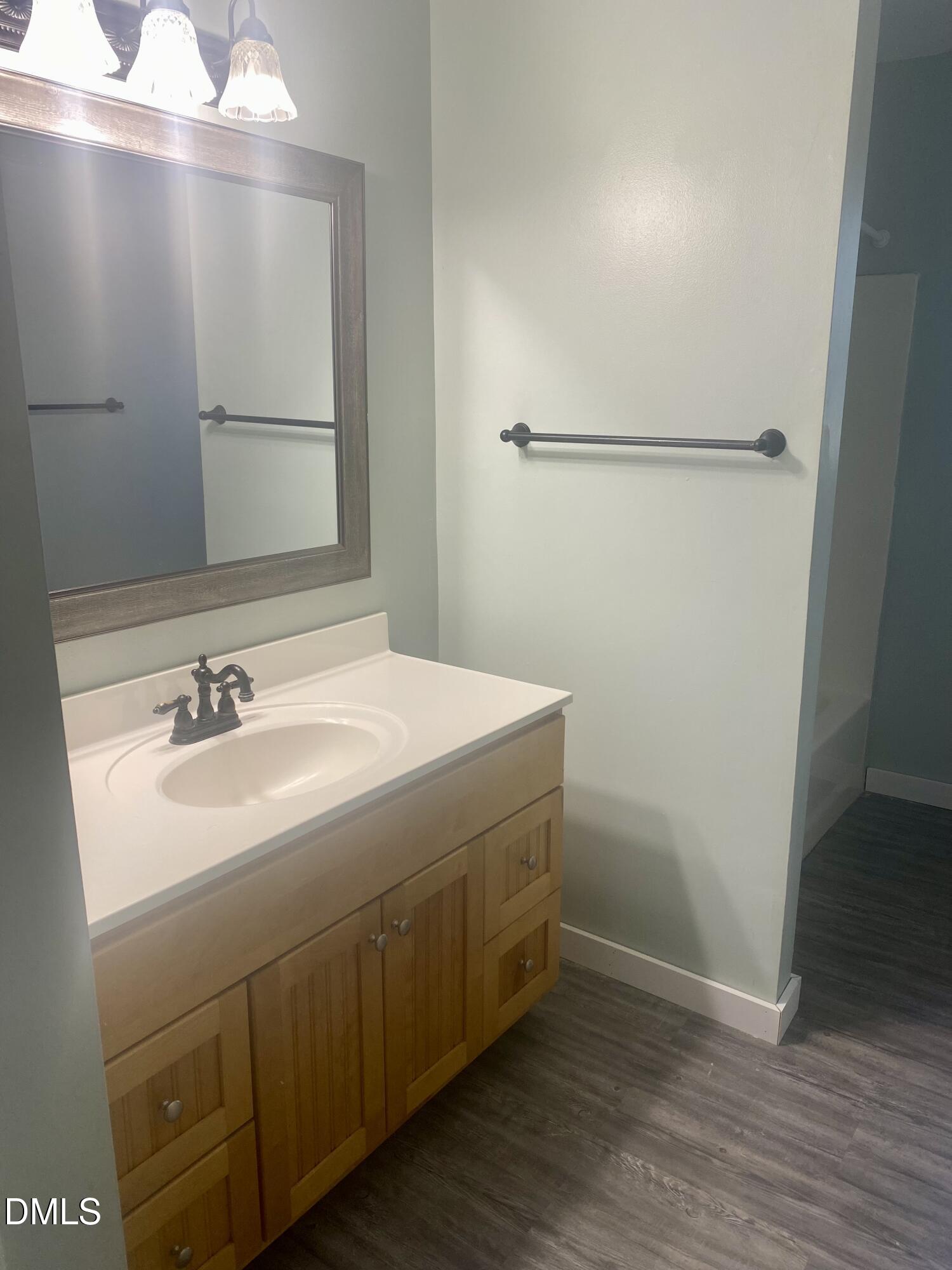 3182 Sims Bridge Road Kittrell, NC 27544 - Photo 39 of 44 a bathroom with a sink and a mirror