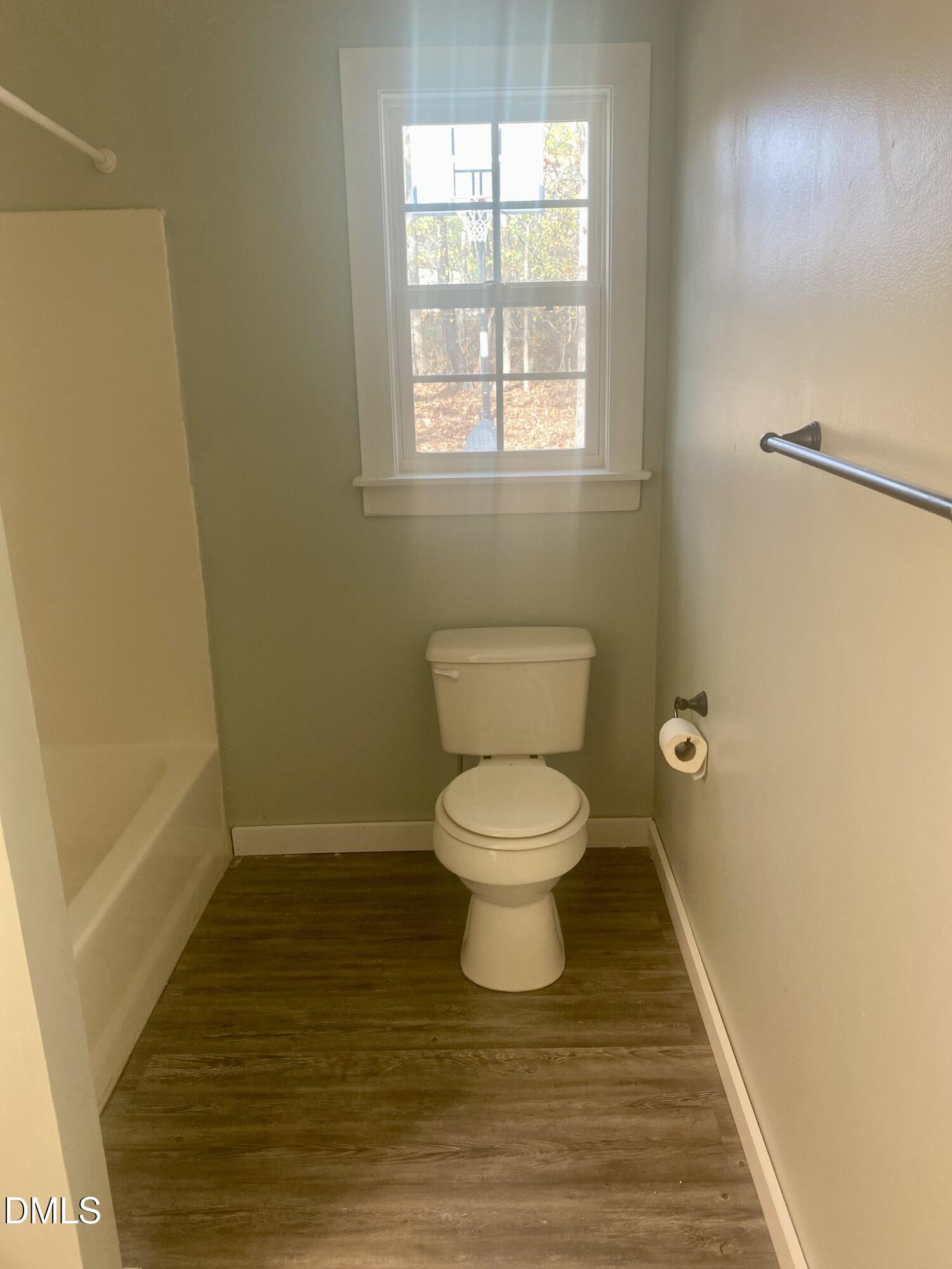 3182 Sims Bridge Road Kittrell, NC 27544 - Photo 40 of 44 a bathroom with a toilet and a shower