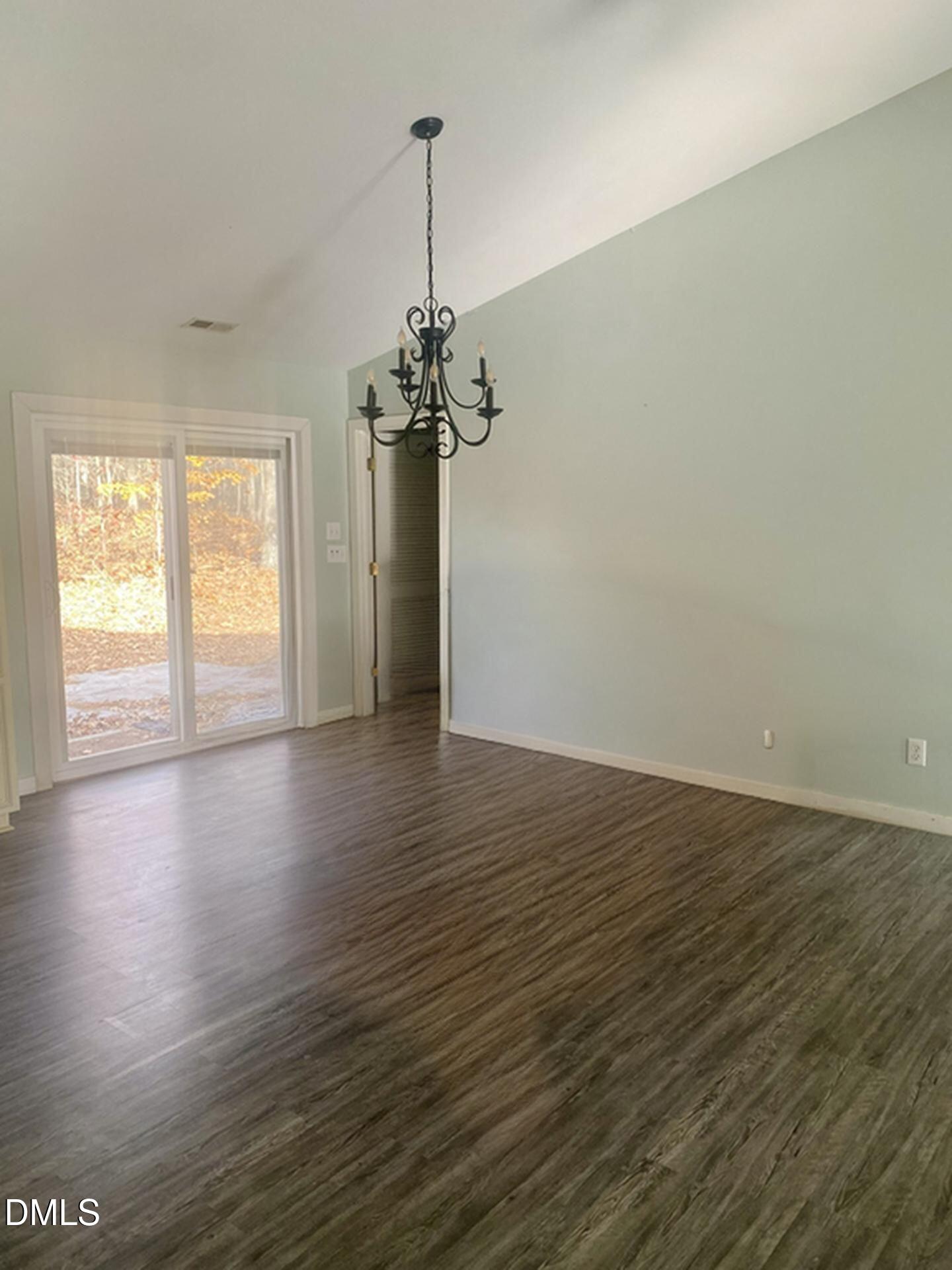 3182 Sims Bridge Road Kittrell, NC 27544 - Photo 6 of 44 a view of empty room with wooden floor and window