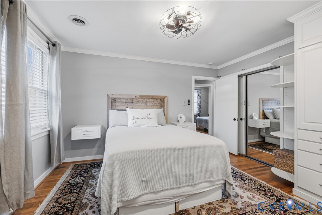 5800 West Rois Road Richmond, VA 23227 - Photo 15 of 32 a bedroom with a large bed and a rug