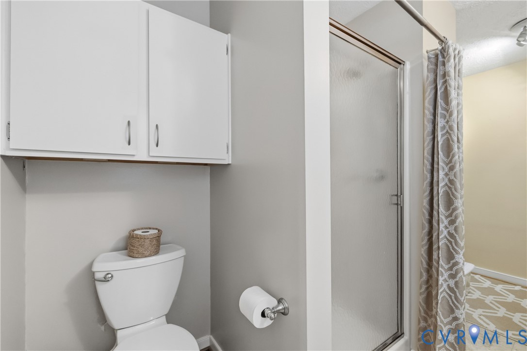 5800 West Rois Road Richmond, VA 23227 - Photo 18 of 32 a bathroom with a toilet and a sink